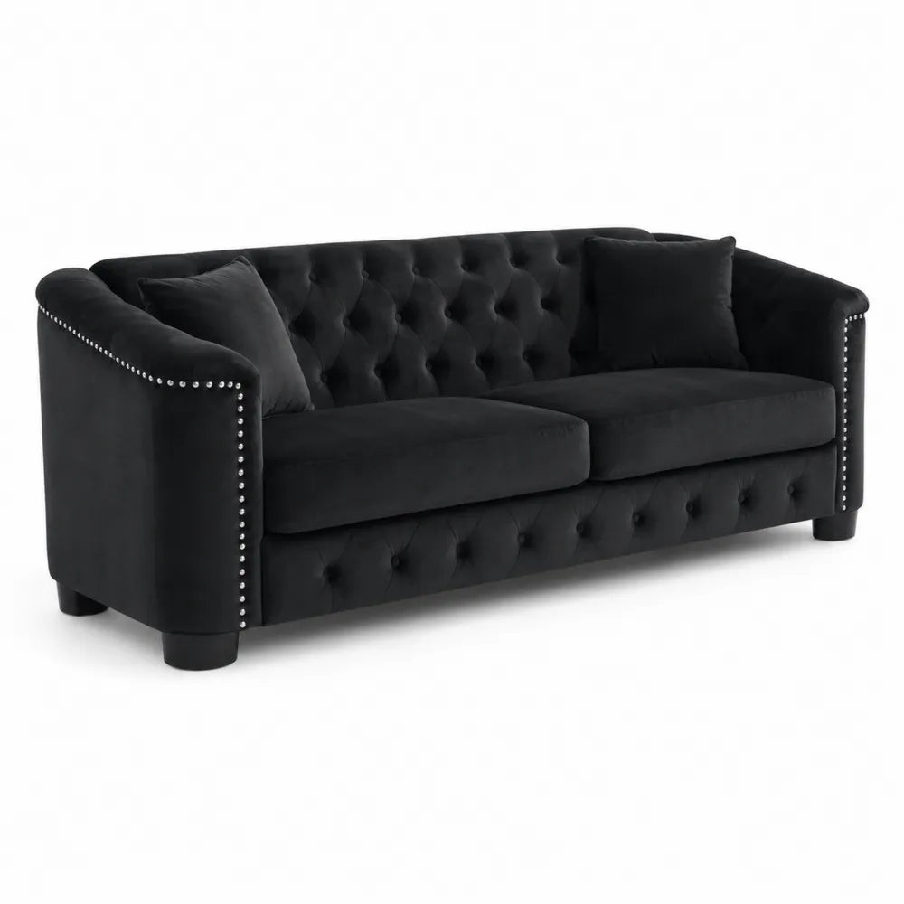 Sof¨¢ de terciopelo negro con tachuelas 22